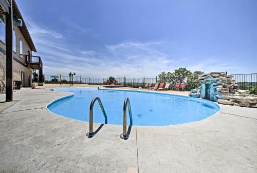 a large blue swimming pool with two metal handles at The Perch - Cove on Indian Point in Branson