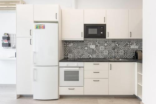 Kuchyňa alebo kuchynka v ubytovaní Charming loft B