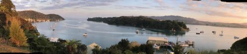 a view of a large lake with boats in it at Mangonui Motel in Mangonui