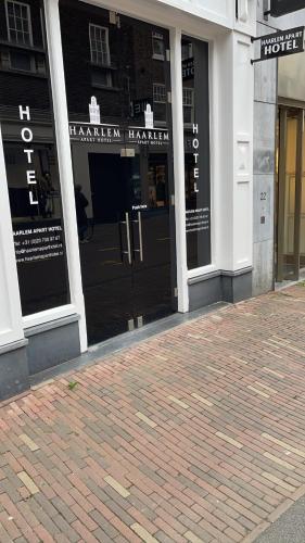 a store front with glass doors on a building at Haarlem Apart Hotel in Haarlem