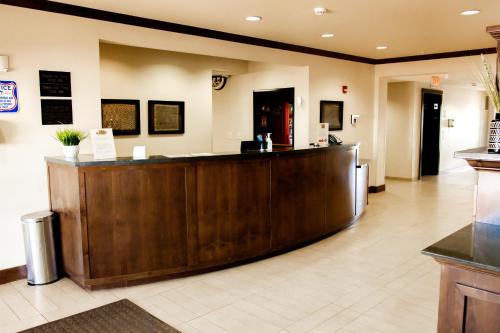 a lobby of a hospital with a reception desk at Black Gold Suites Stanley in Stanley