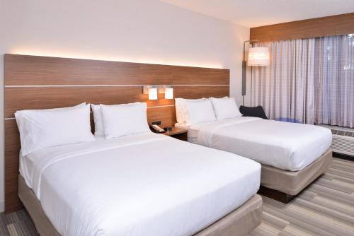 a hotel room with two beds and a window at Holiday Inn Express & Suites Indianapolis Dtn-Conv Ctr Area by IHG in Indianapolis