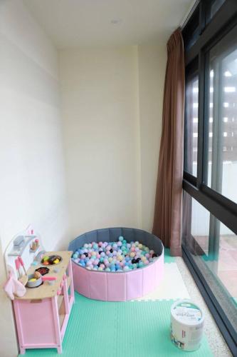 a childs play room with a pool of balls at 23 Here B&B in Hualien City