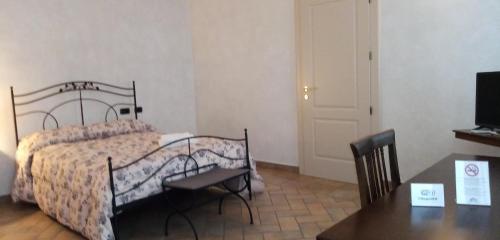 Postel nebo postele na pokoji v ubytování B&B Residence il Ciliegio , Via Villa Superiore 93 Luzzara
