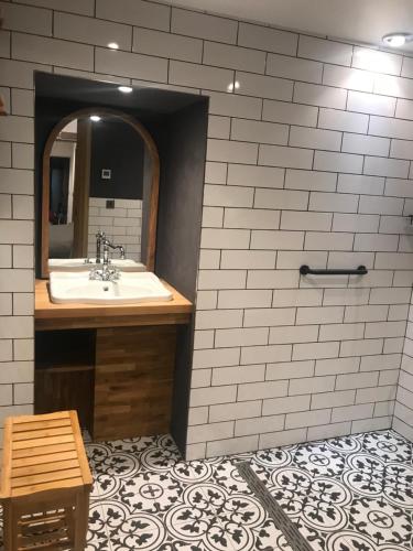 a bathroom with a sink and a mirror at The Stables near Glasgow in Balmore