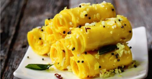 a plate of pasta with black pepper on it at Hotel Fun Residency by Antra Group in Ahmedabad