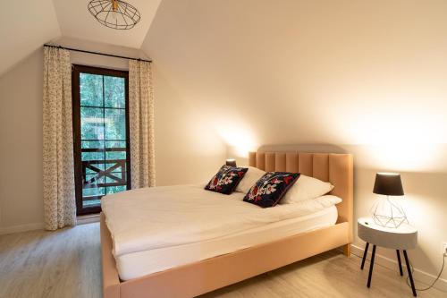 Postel nebo postele na pokoji v ubytování Warmia Resort
