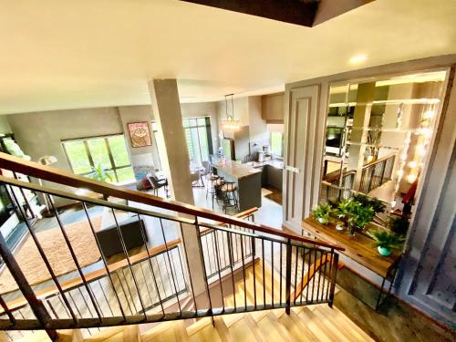 a view of a living room and kitchen from the second floor at Faizal Madhi Homestay in Kuching