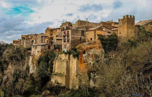 a group of buildings on top of a mountain at Abbracci Home Barbarano in Barbarano Romano