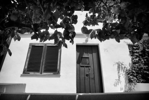 a building with a door and a window at Gattopardo Park Hotel in Lipari