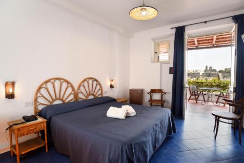 Postel nebo postele na pokoji v ubytování Gattopardo Park Hotel