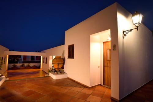 a hallway of a house at night with a light at Gattopardo Park Hotel in Lipari