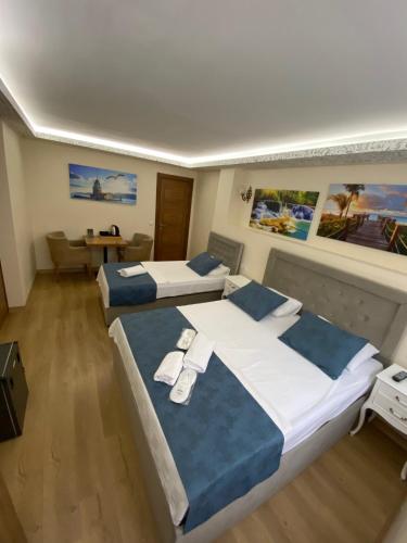 Кровать или кровати в номере ÜSKÜDAR OTEL