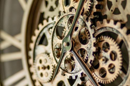 a close up of a clock with gears at Harzfalke Apartment - Ankommen und wohlfühlen. in Wieda