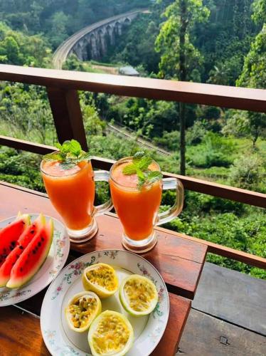 a table with plates of food and pitchers of juice at Barn Hills in Ella