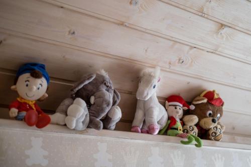a row of stuffed animals sitting on a shelf at Private Villa with indoor pool in Budapest
