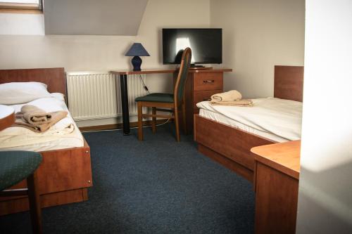 Posteľ alebo postele v izbe v ubytovaní Hotel Ach To Tu