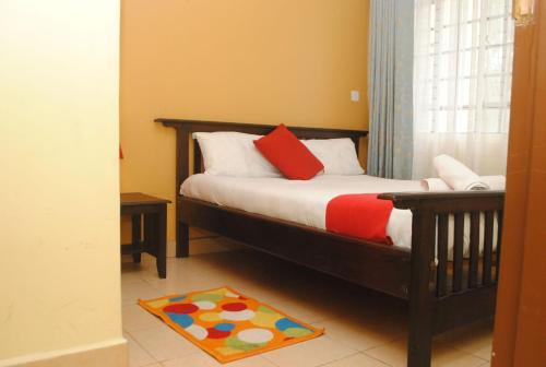 Кровать или кровати в номере Kijani 1BRM Westlands