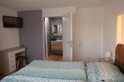 Postelja oz. postelje v sobi nastanitve Ferienwohnung Casa Rosa