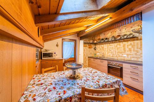 a kitchen with a table with a bowl on it at Tizzi Home in Alleghe