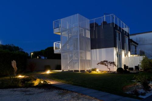 a building at night with lights in front of it at B&B Le Nazioni in Lido delle Nazioni
