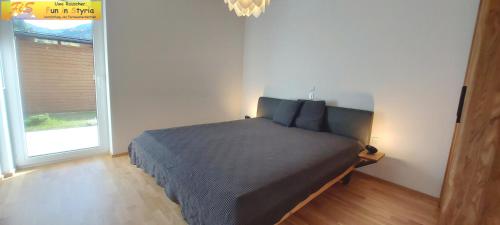 Llit o llits en una habitació de Apartment Bergzeit by FiS - Fun in Styria