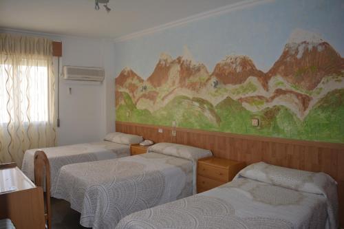 Postel nebo postele na pokoji v ubytování Hostal Manolete