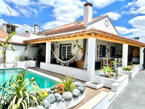 a house with a swimming pool in front of it at Casa Holi in Valada