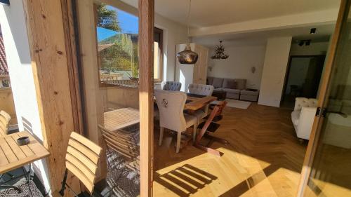 a living room with a table and a dining room at Rocks Schladming in Schladming