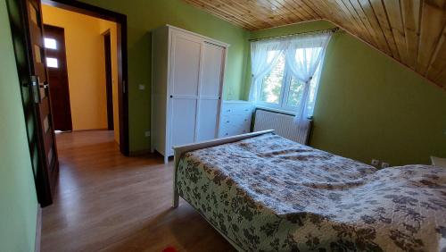 En eller flere senger på et rom på Agroturystyka Zielony Zakątek