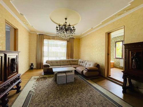a living room with a couch and a table at Hostel Kutaisi by Kote in Kutaisi