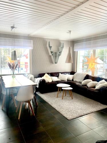 a living room with a couch and a table at Levin Rölli 2 in Levi