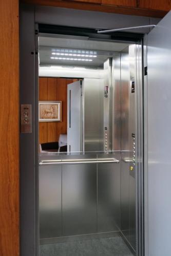 a glass door leading into a kitchen with at Hotel Find in Stuttgart