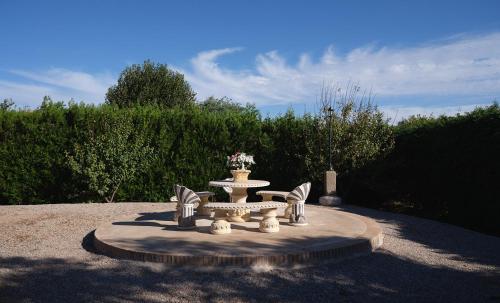 a statue of a fountain in a park at VILLA BASILIO in Constantina