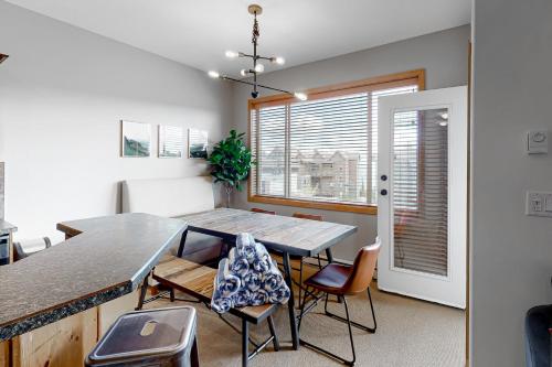 a dining room with a table and chairs at Bears Paw 5 in Big White