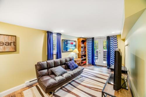 a living room with a couch and a tv at 6 Bedroom House at Schroon River in Brant Lake