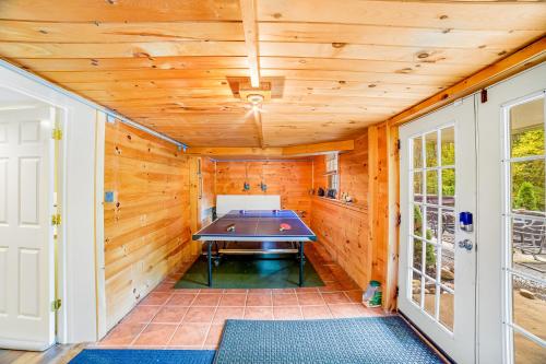 a pool table in a room with wooden walls at 6 Bedroom House at Schroon River in Brant Lake