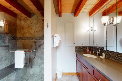 a bathroom with a sink and a shower at Winhall Wonder in French Hollow