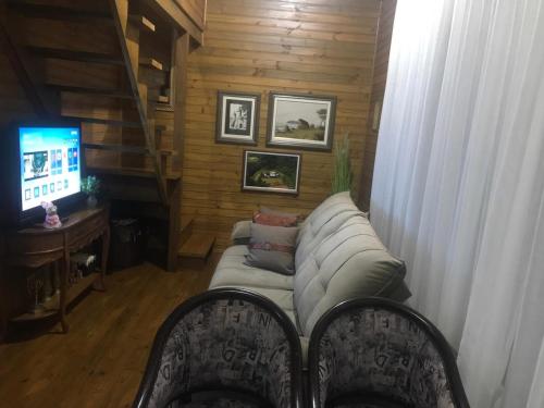 TV a/nebo společenská místnost v ubytování Espetacular sítio com belíssima paisagem para descansar
