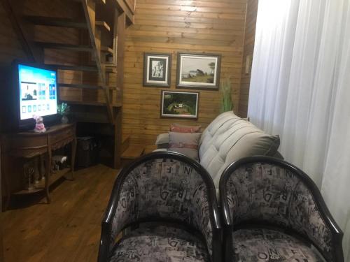 TV a/nebo společenská místnost v ubytování Espetacular sítio com belíssima paisagem para descansar