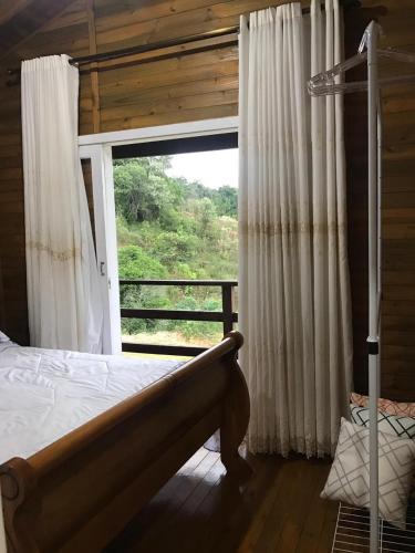 Postel nebo postele na pokoji v ubytování Espetacular sítio com belíssima paisagem para descansar