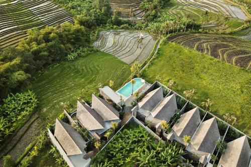 an aerial view of a house with a garden at Astera Resort Canggu by Ini Vie Hospitality in Canggu