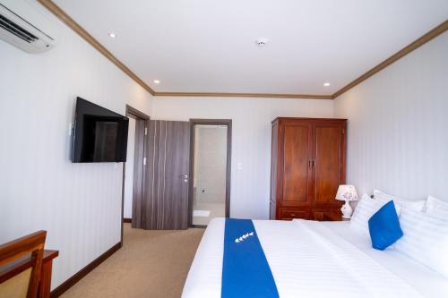 Postel nebo postele na pokoji v ubytování Navy Hotel Cam Ranh
