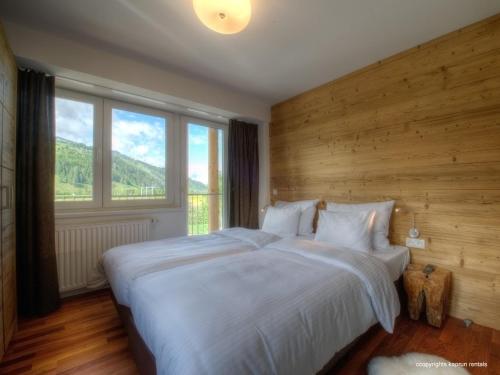 מיטה או מיטות בחדר ב-Residence Alpin Kaprun by Kaprun Rentals