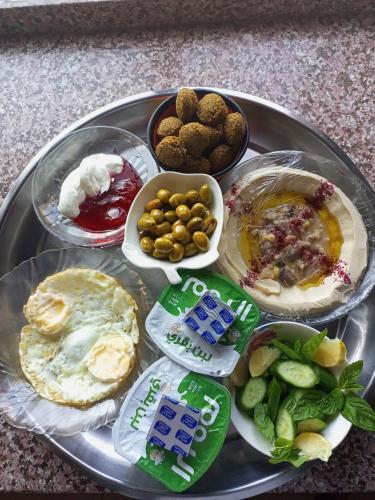 a tray with different types of food on a table at moon valley site jerash in Jerash