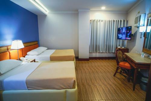 Postel nebo postele na pokoji v ubytování Hotel Valencia