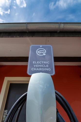 a sign on the side of a car parked in front of a building at Kyriad Prestige Beaune le Panorama in Beaune