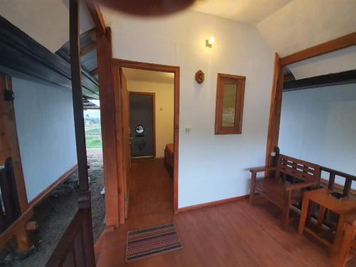 a hallway of a house with a door leading into a room at Rinjani Camp Sajank in Sajang