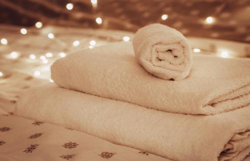 a stack of towels sitting on a table at Apartmán Wellness Sedmihorky in Turnov