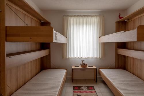 Posteľ alebo postele v izbe v ubytovaní Chalet Love The Alps by All in One Apartments